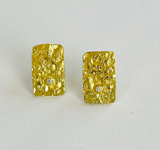 18K gold textured studs with diamond.
