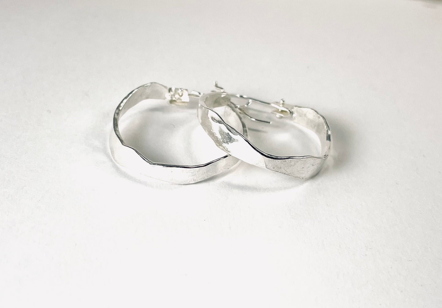 Sterling silver wavy hoops