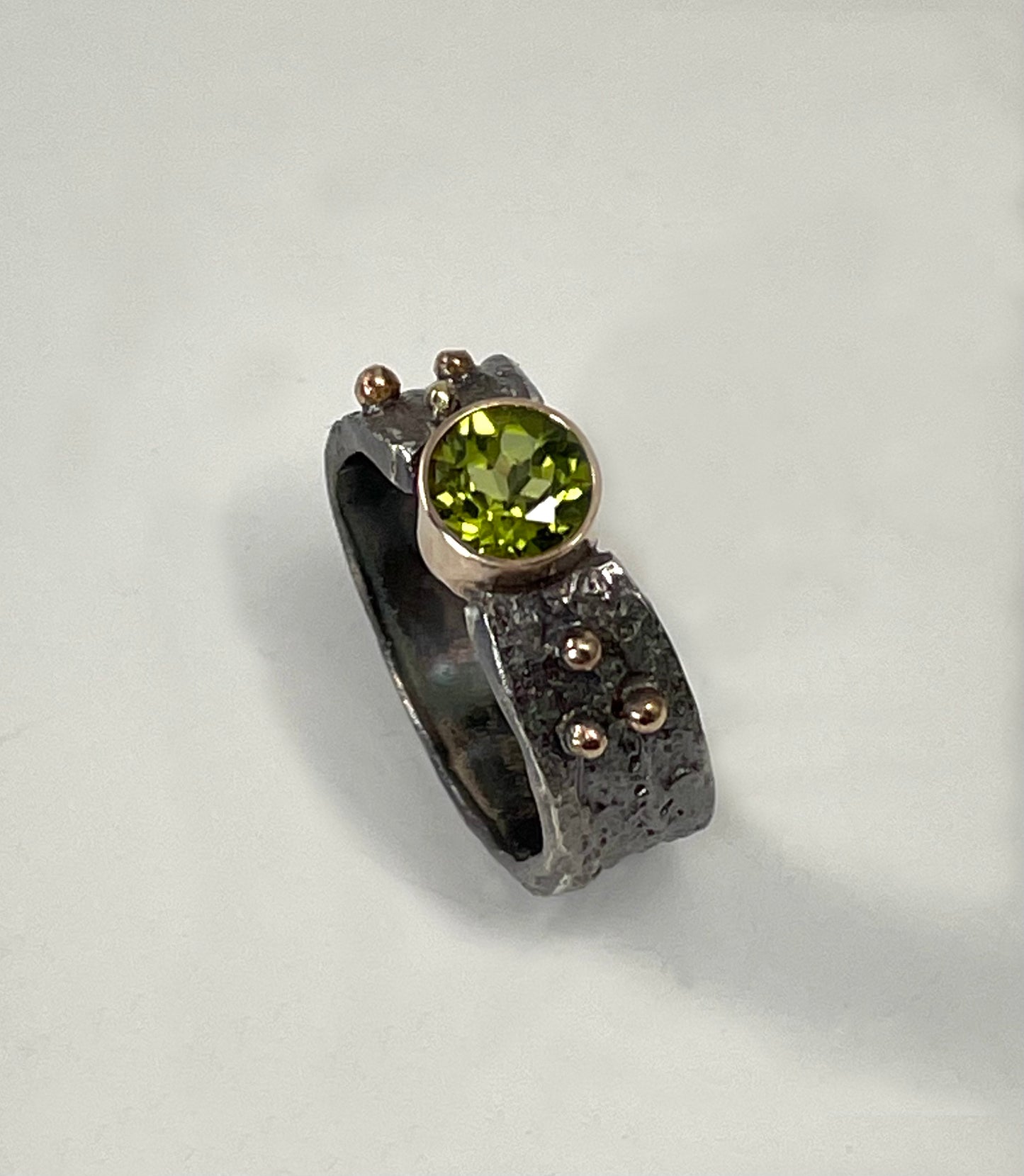 Silver and  peridot ring