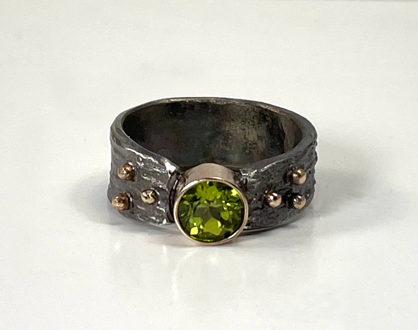 Silver and  peridot ring