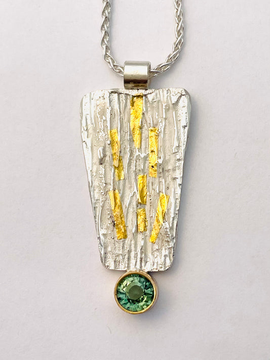 Sterling silver and faceted green tourmaline pendant.