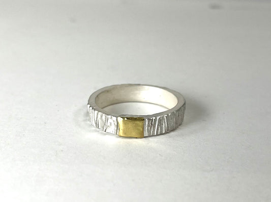 Sterling silver textured band with 18k gold accent