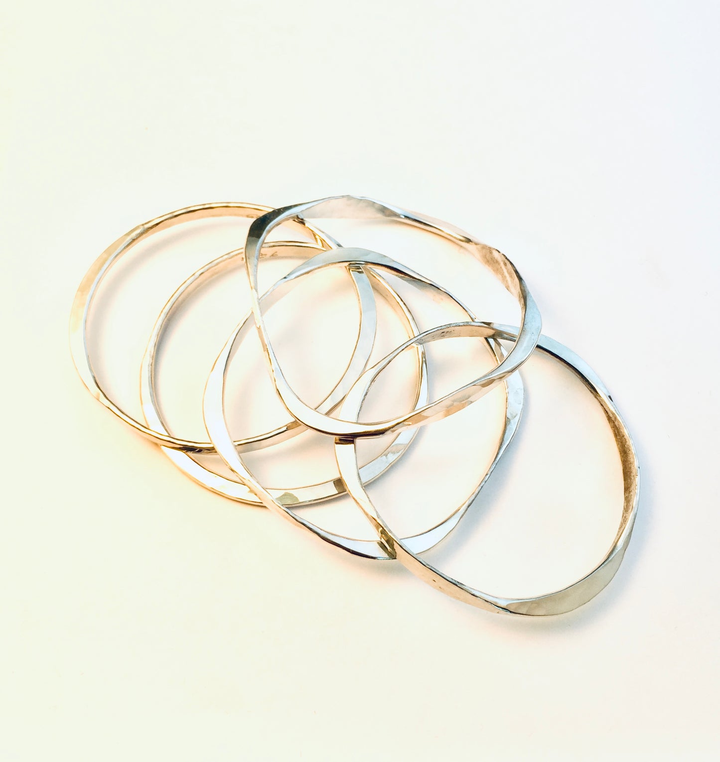 Sterling silver hand forged oval bangle.