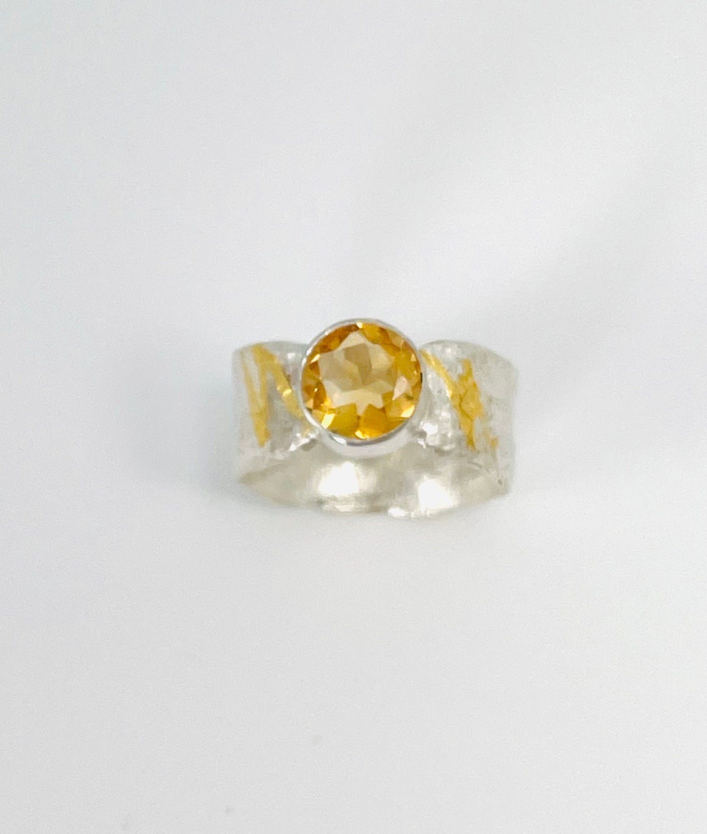 Citrine ring in silver with gold accents