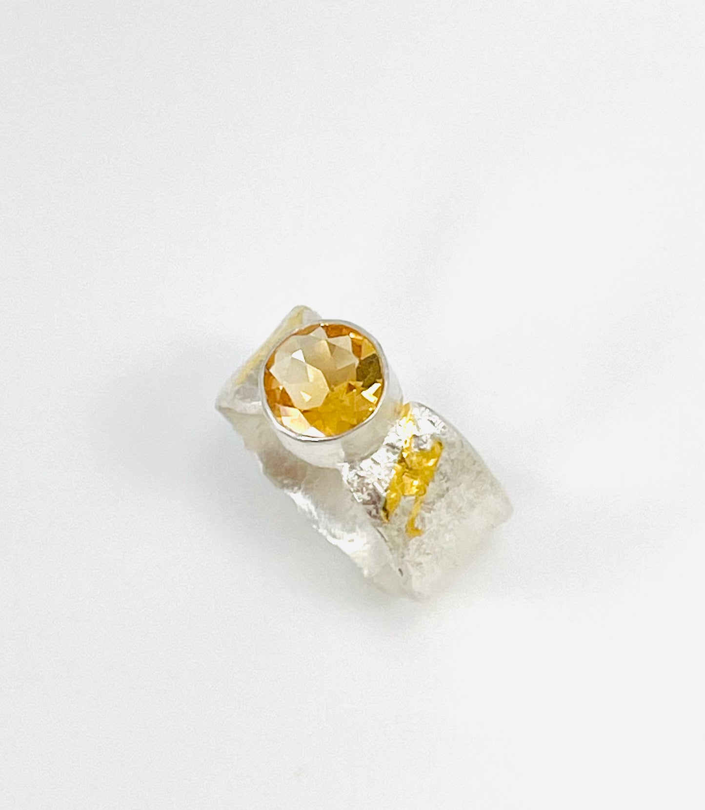 Citrine ring in silver with gold accents