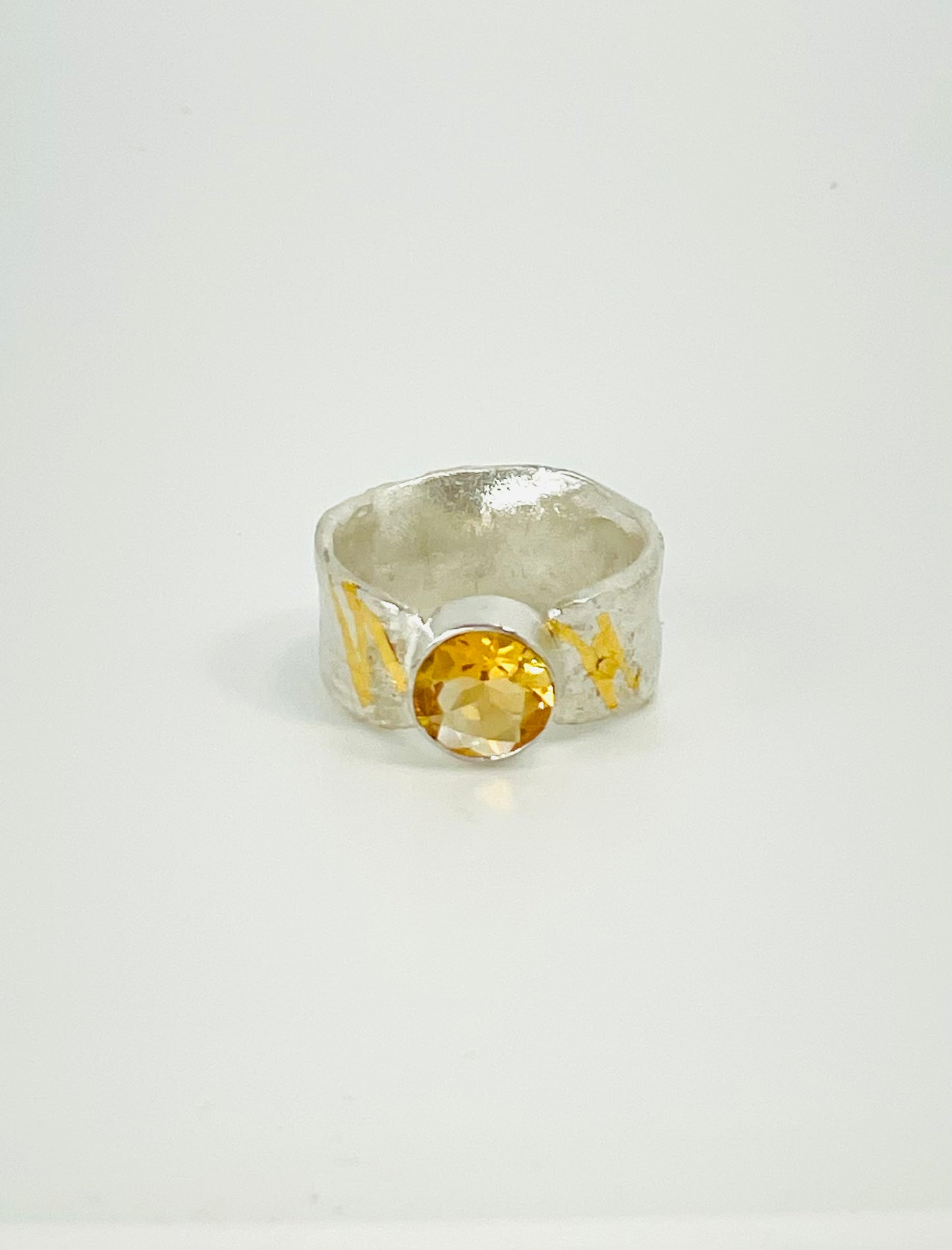 Citrine ring in silver with gold accents