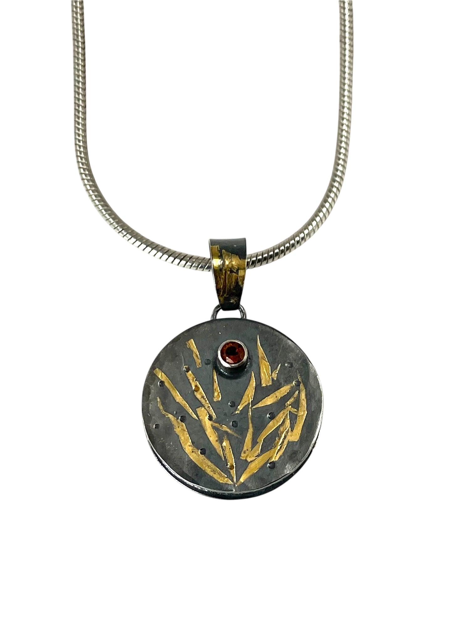 Faceted citrine bead necklace with a sterling silver/gold pendant